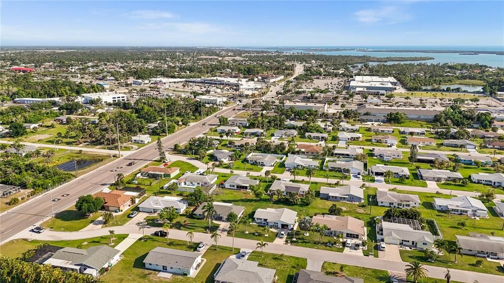 This is an aerial shot of the general neighborhood showing the proximity to Publix Shopping Center and the water.