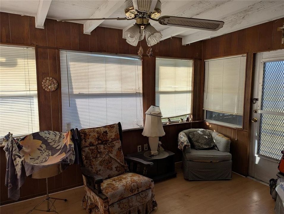 Enclosed Lanai has access from the Kitchen/Dining area.  It also has a separate door into the back yard.