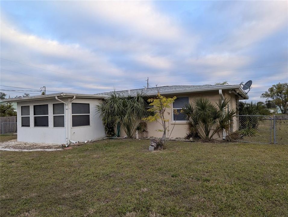 Rear side of the home has a southern exposure.  The enclosed lanai is well lit with windows.