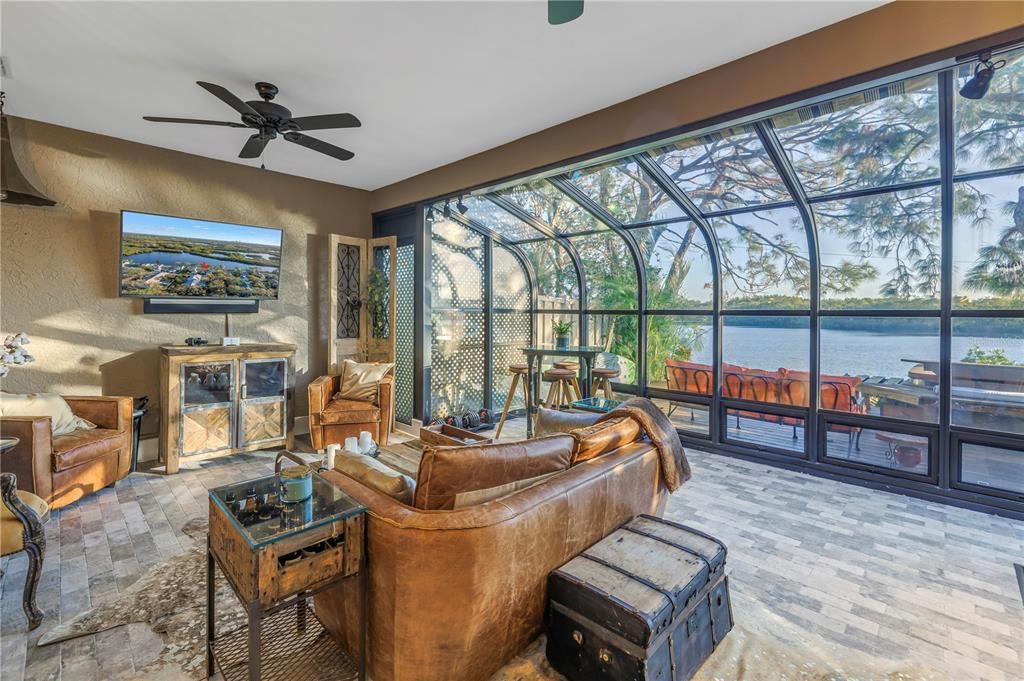 Cozy warm comfort in this amazing Florida room overlooking the backyard panoramic view.