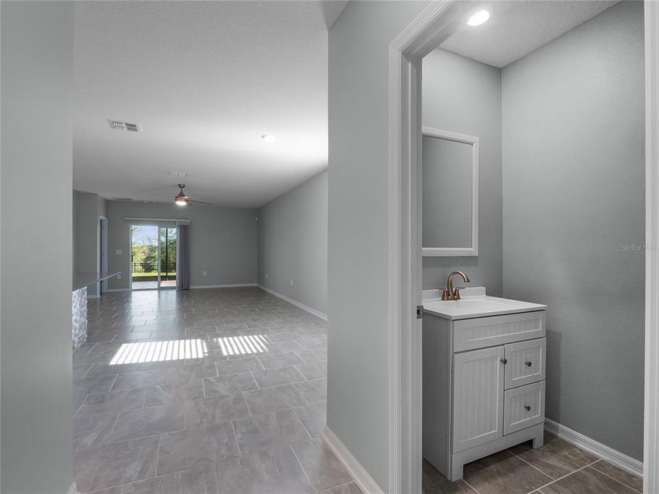 half bath for guests with upgraded vanity.