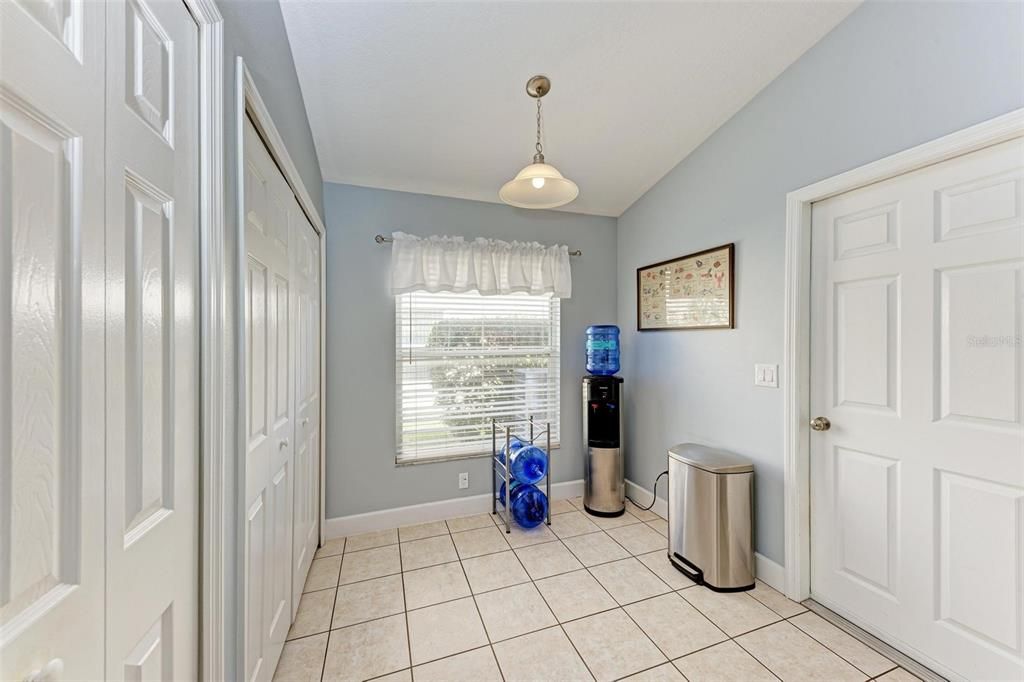 Eating area, double doors have washer/dryer behind.  Door is to the garage