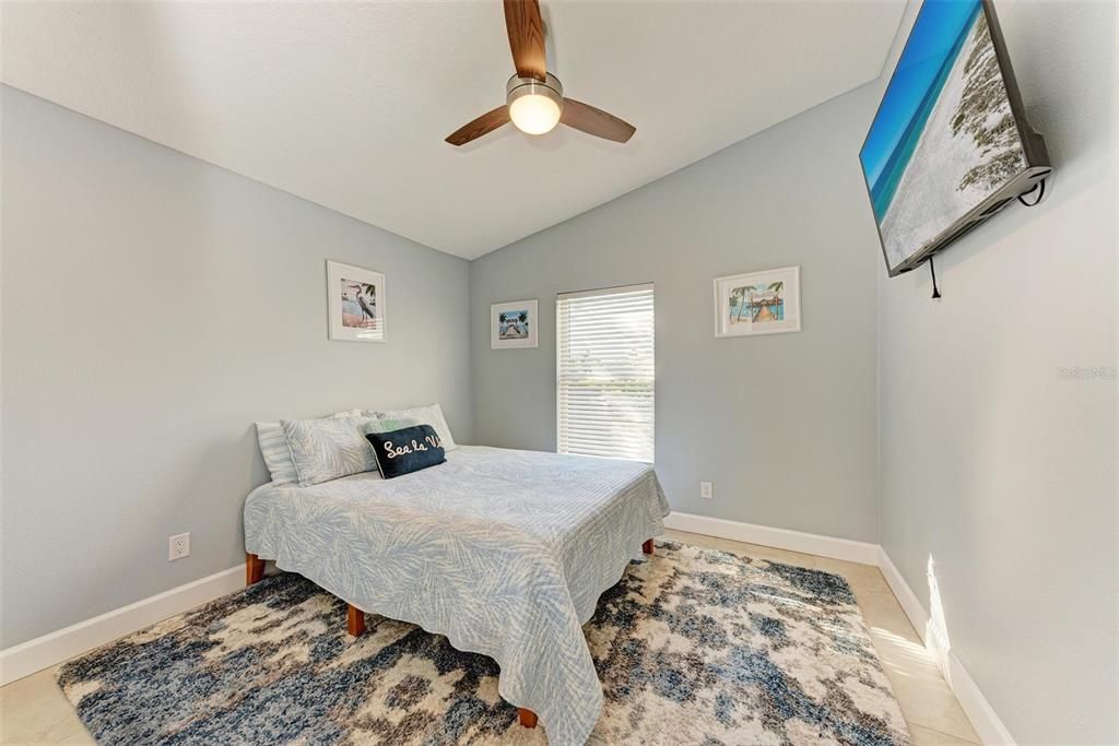 Bedroom #2 - colors remind you of being at a spa!  Relax and take a nap or read a book!  Tile floors and a full closet.