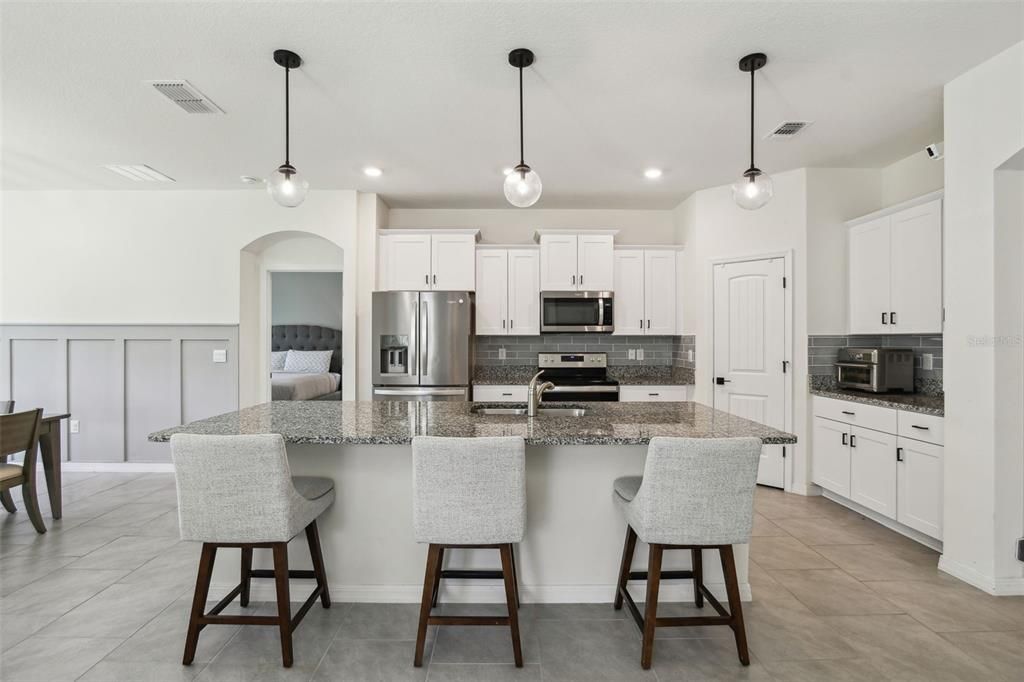 The kitchen overlooks both the living room and dining room.