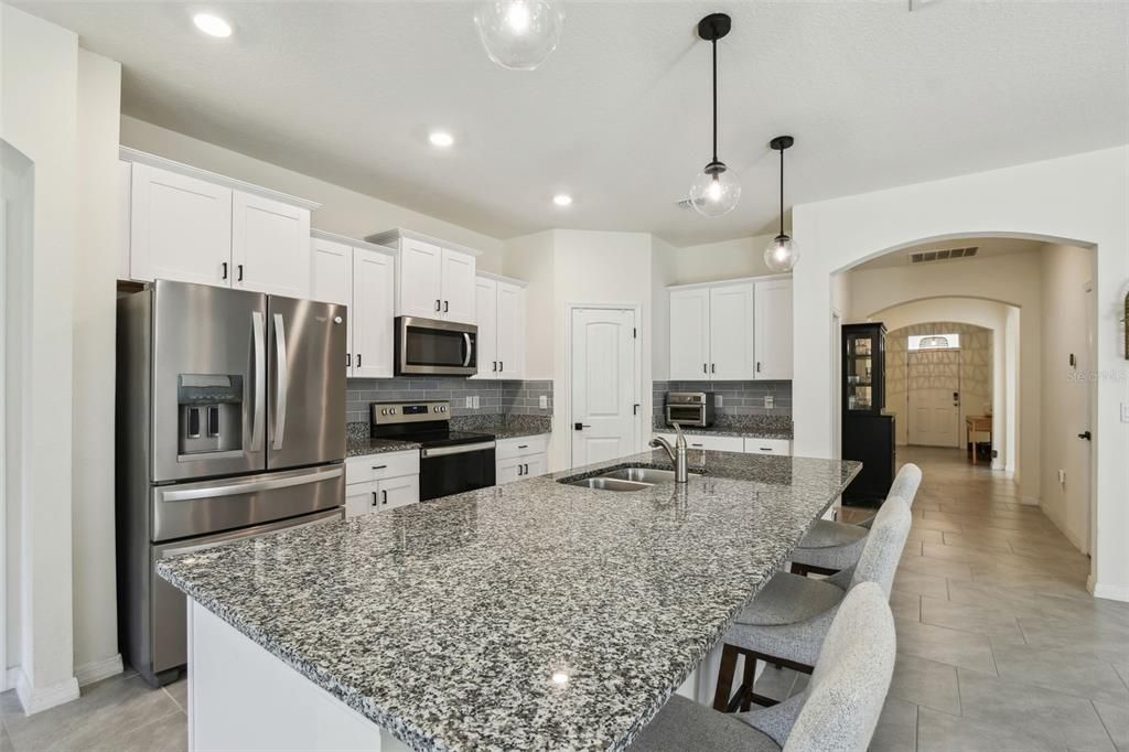 The kitchen overlooks both the living room and dining room.