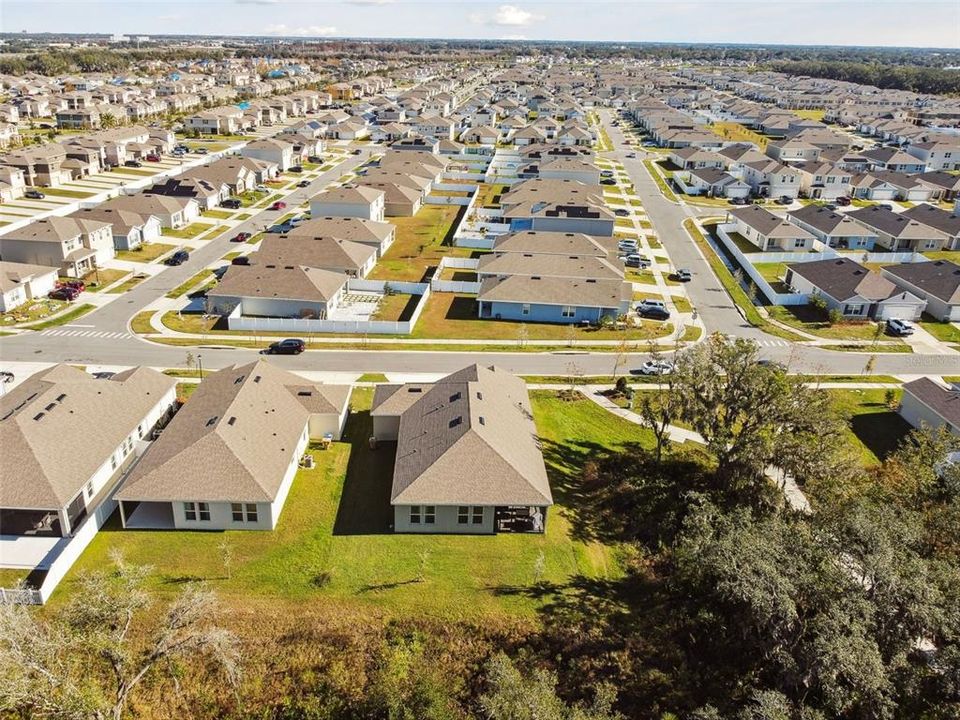 The home provides a peaceful view of the scenic wooded area, with no neighbors behind or to the left.