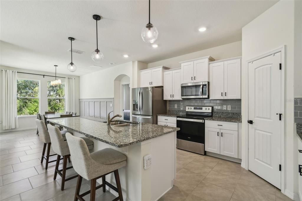 The kitchen overlooks both the living room and dining room.