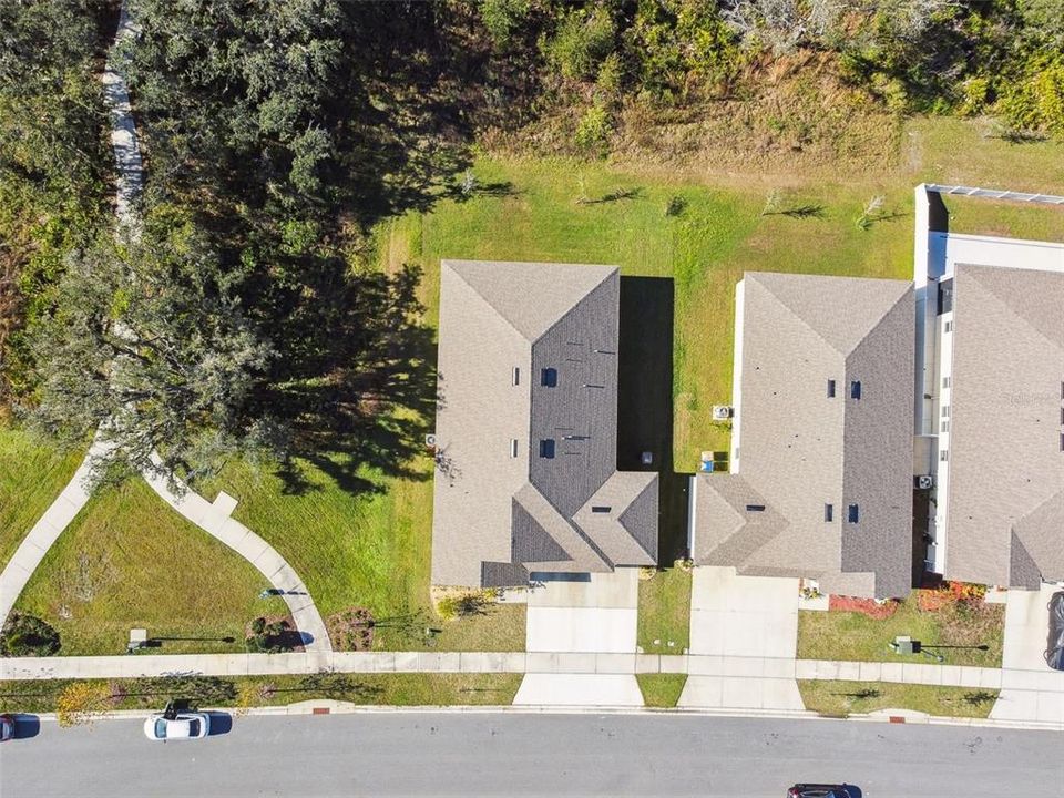 The home provides a peaceful view of the scenic wooded area, with no neighbors behind or to the left.