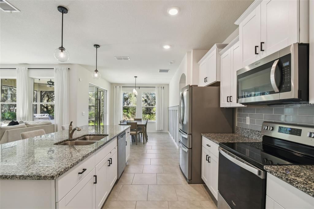 The kitchen overlooks both the living room and dining room.