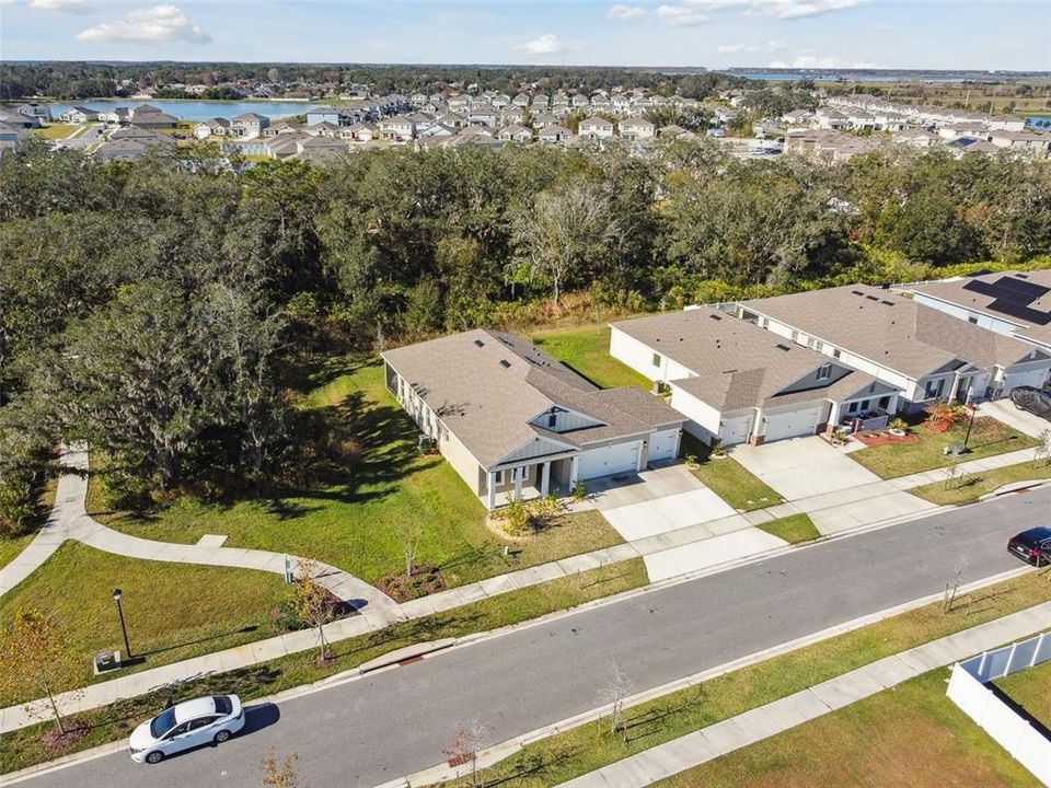 The home provides a peaceful view of the scenic wooded area, with no neighbors behind or to the left.