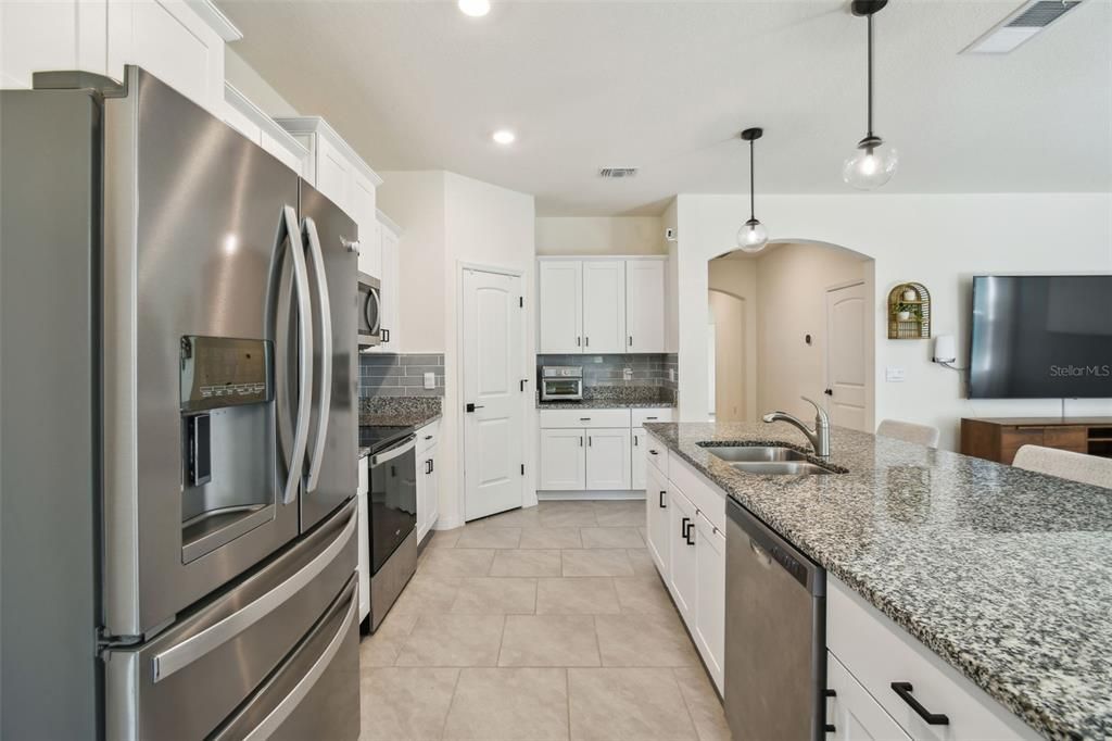 The kitchen overlooks both the living room and dining room.