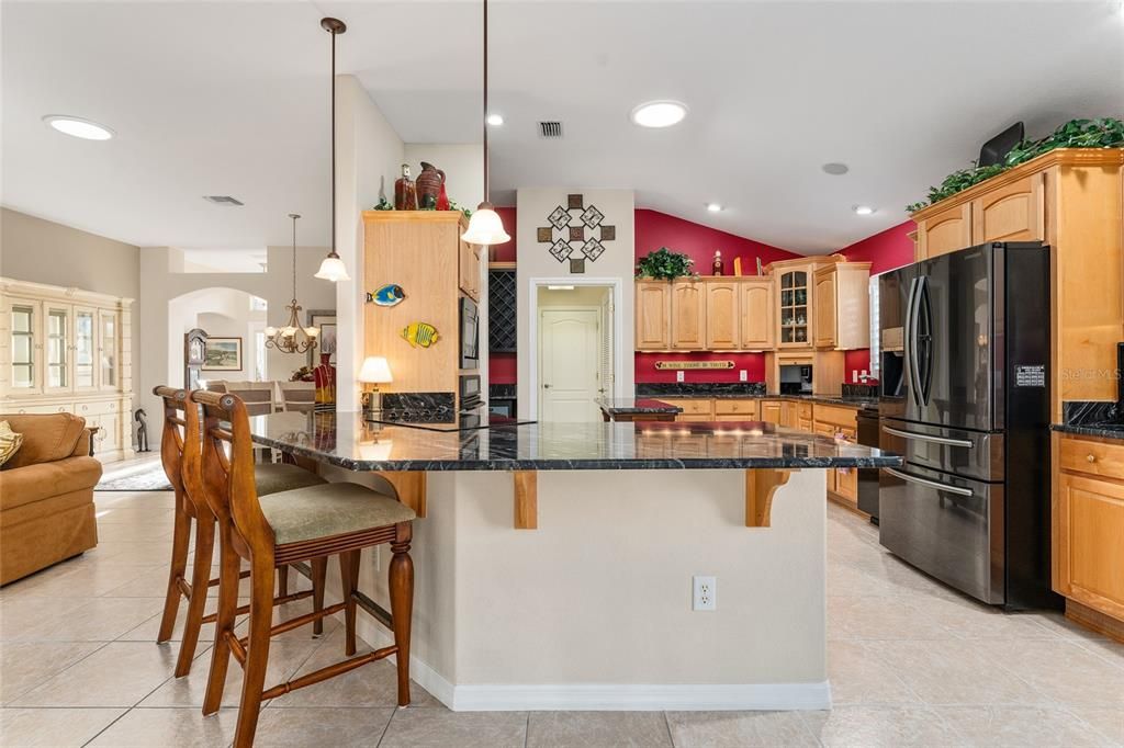 KITCHEN VIEW TO LAUNDRY ROOM AND GARAGE