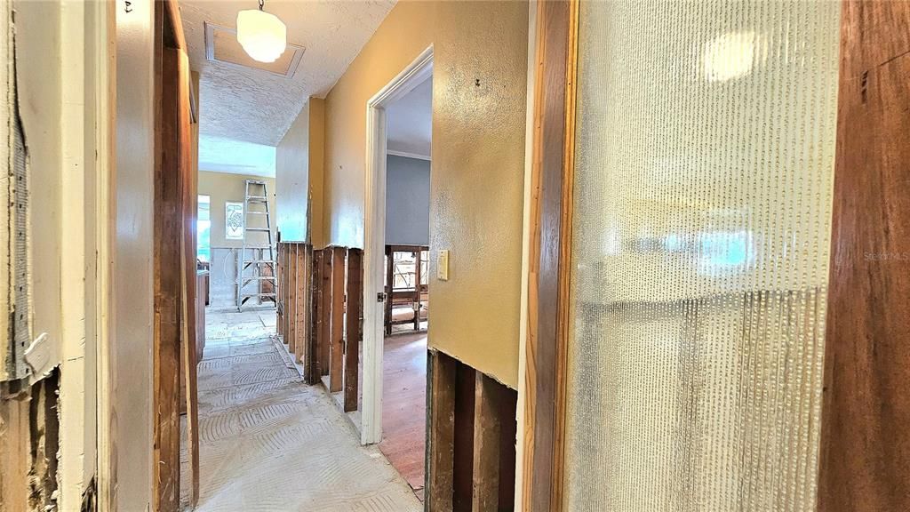 Kitchen is at the end of the Hallway. This is a SPLIT floor plan and Master is on this side next to kitchen and garage.