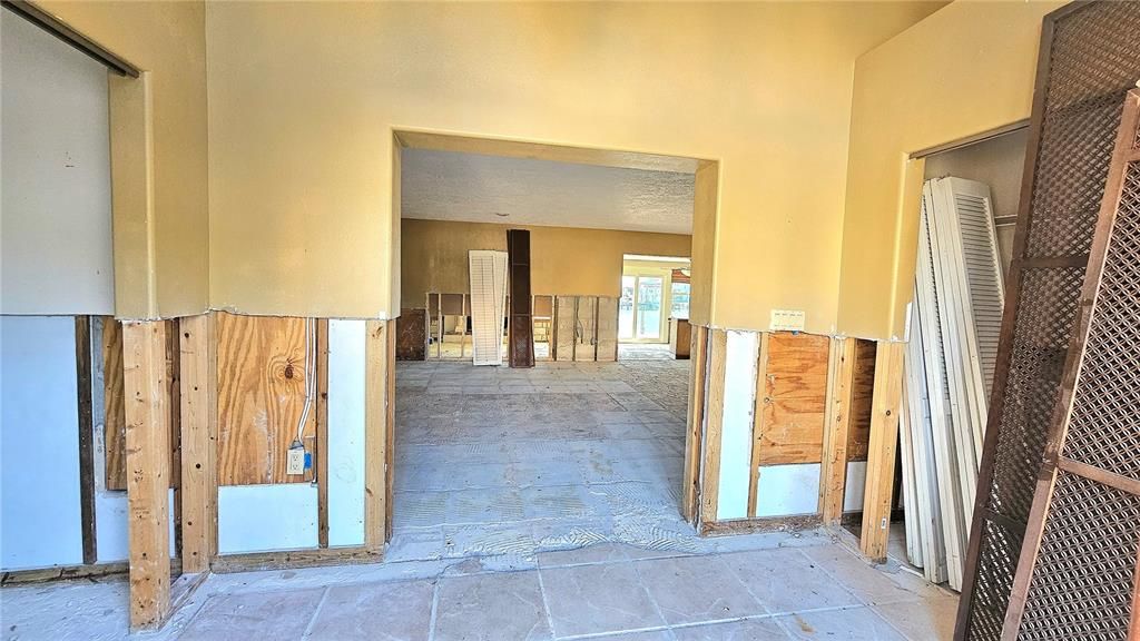 Foyer Entry. Closets on each side. Terrazzo flooring is underneath tile.