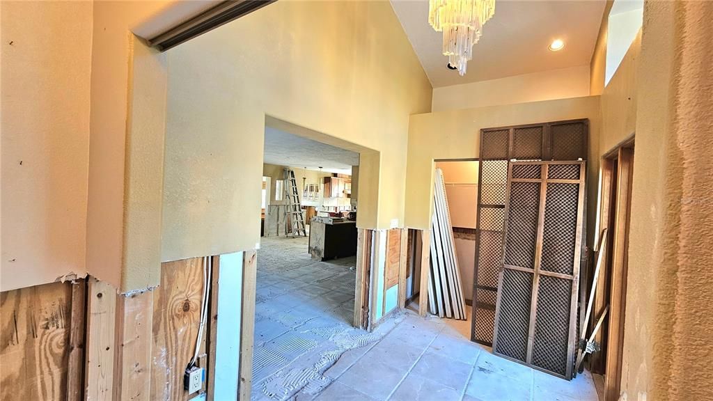 Foyer side view. Foyer ceilings are vaulted.