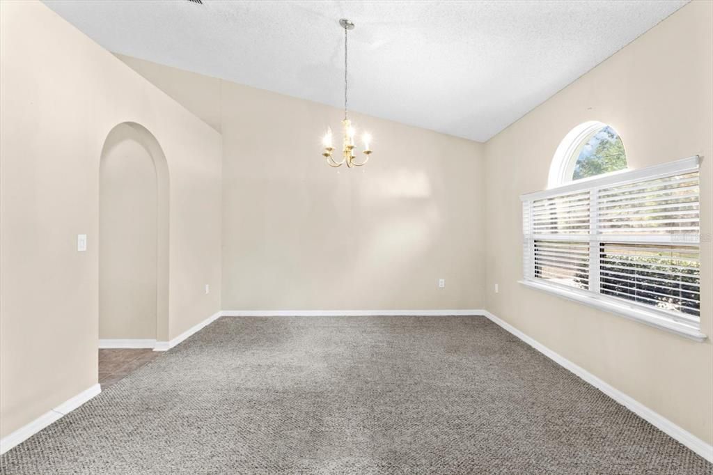 Formal Dining Room w/ Vaulted Ceiling...Kitchen to the Left