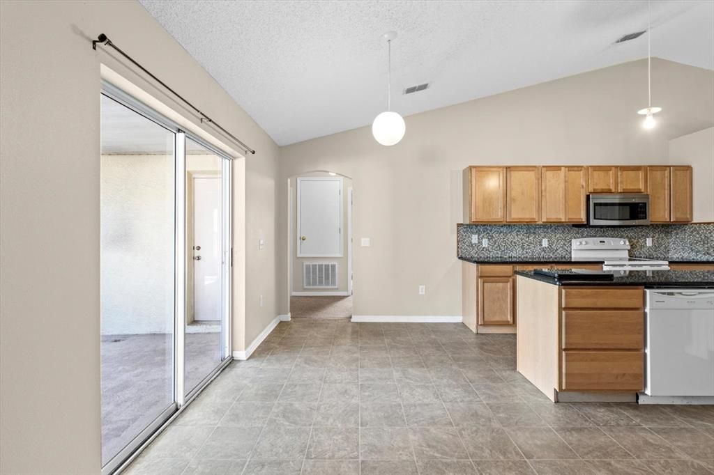 Breakfast Nook Next to Kitchen w/ Slider to the Lanai