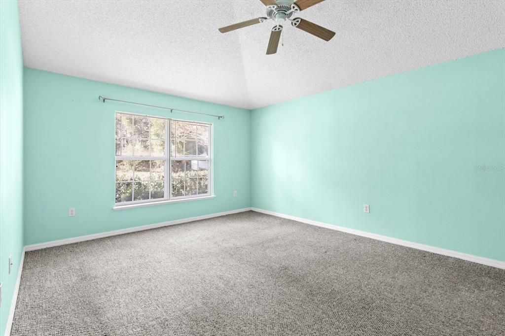 Master Bedroom w/ Vaulted Ceiling, Plant Shelf, Dual Walk In Closets & Ensuite