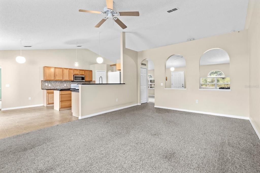 Separate Family Room...Focal Wall with Arched Openings between the Formal Living & Family Rooms