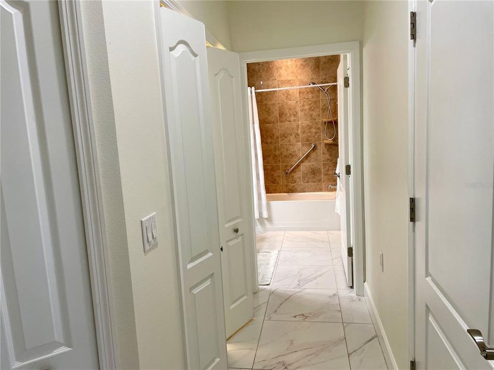 Hallway to guest bathroom and Laundry closet