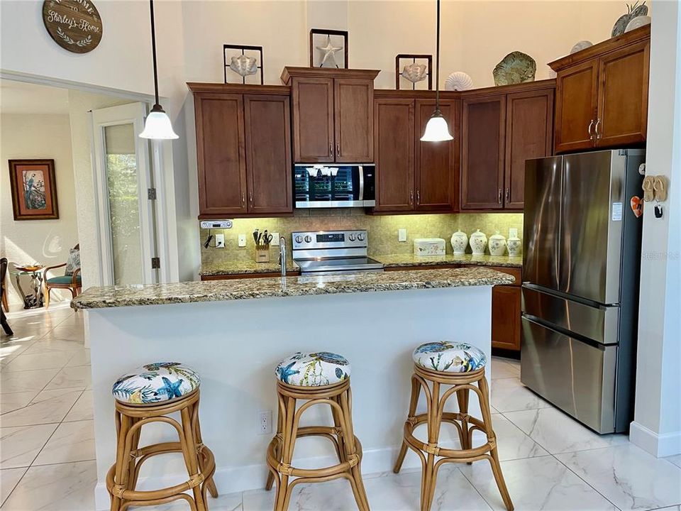 Kitchen has a breakfast bar/island