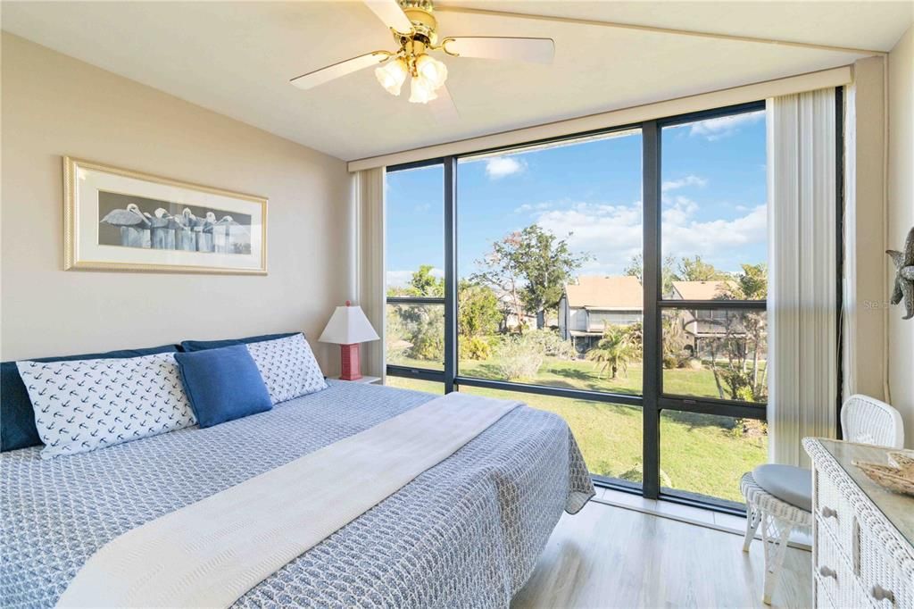 Primary bedroom with HUGE wall of windows!