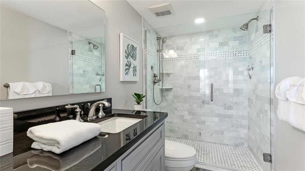 Relax and recharge in the updated, spa-like bathroom.