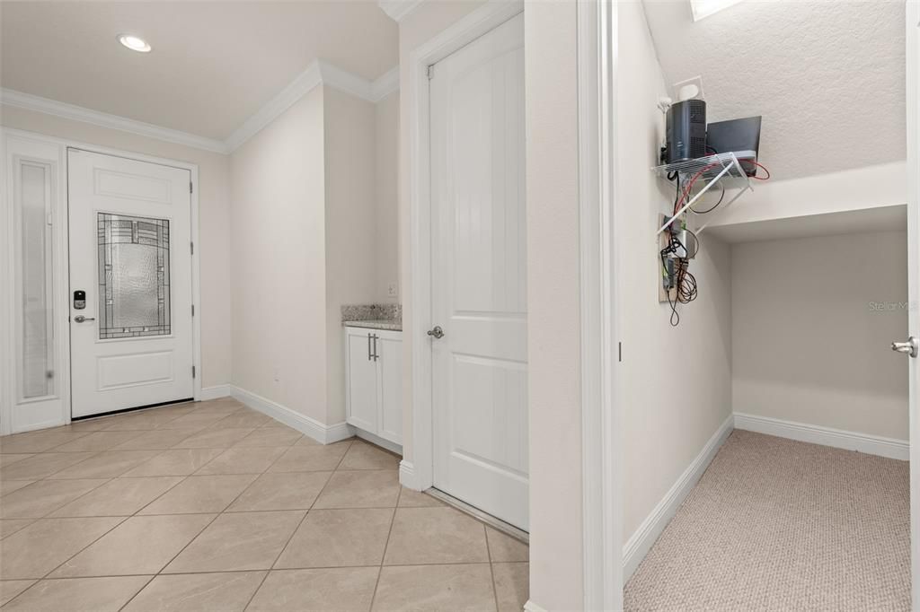 Foyer and storage space under the stairs