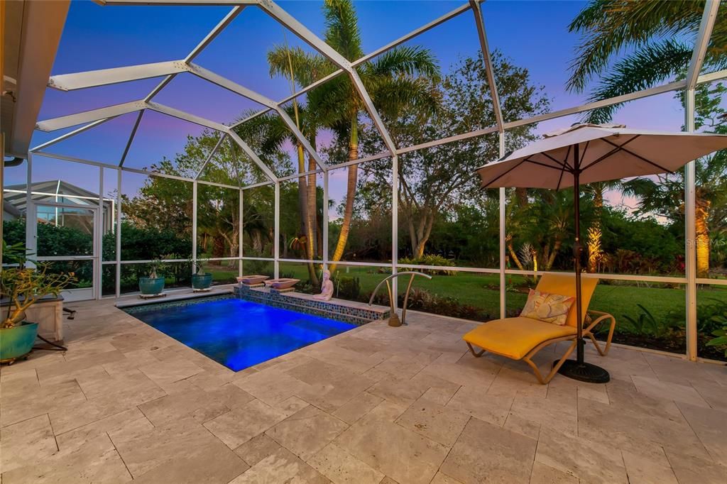 Travertine lanai deck & cascading pool w/ therapy jets.