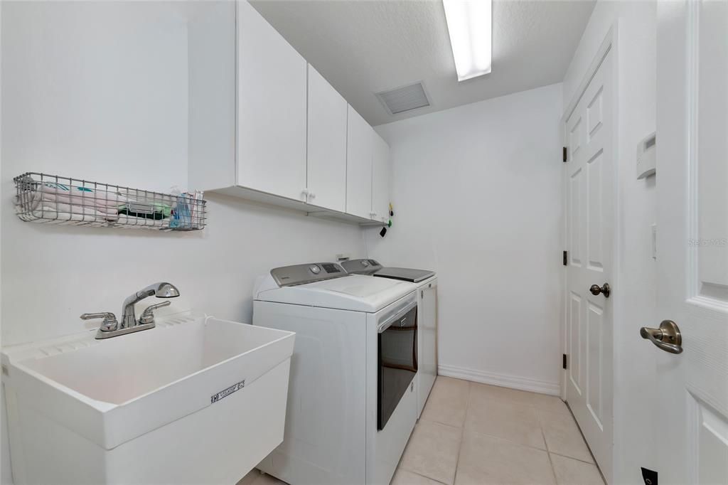 Inside laundry w/ utility sink.