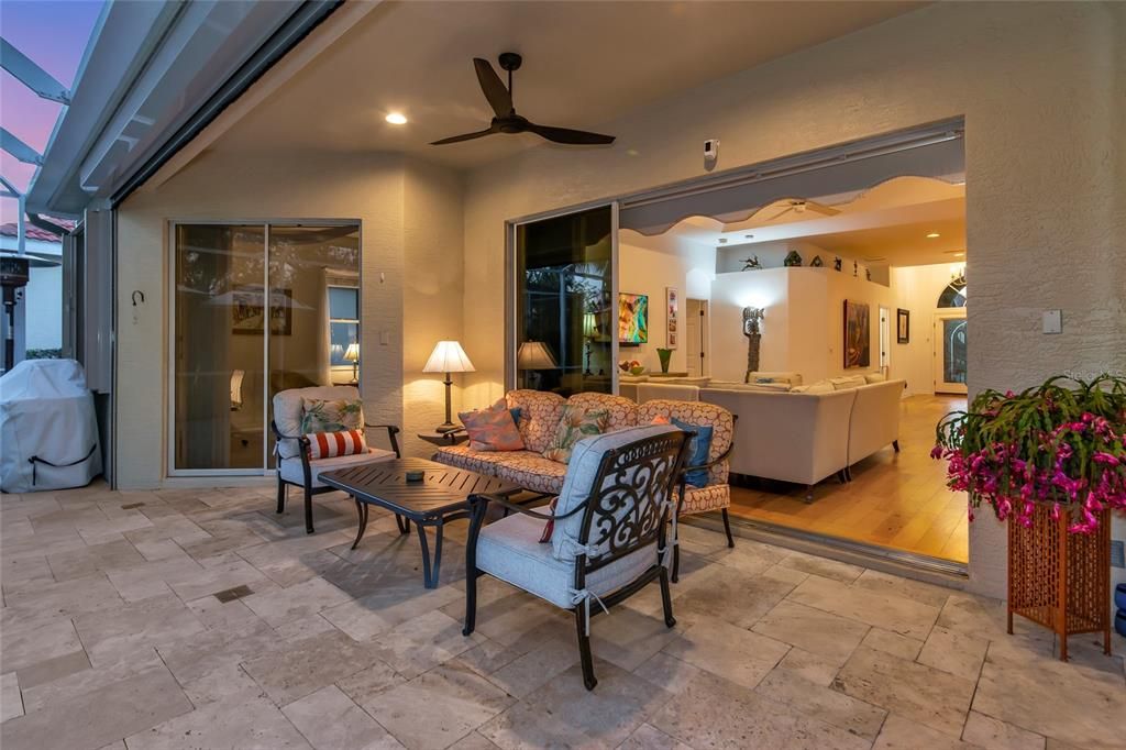 Travertine lanai deck & roll down storm screen.