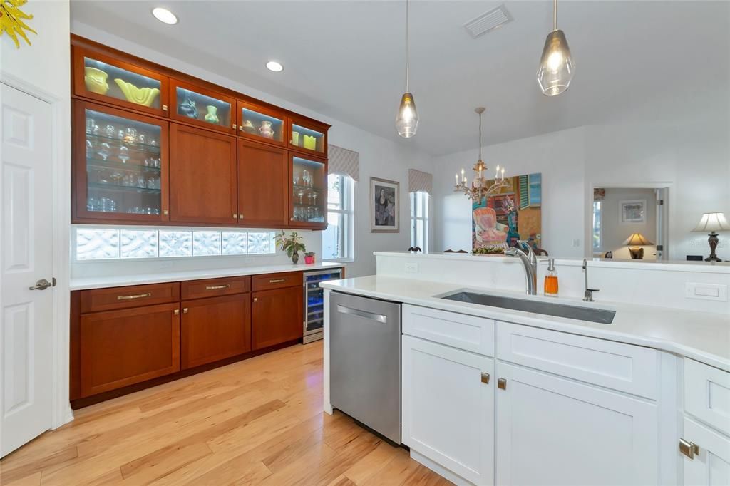 Glass cabinet doors w/LED lighting, Bosh D/W & wine bar refrigerator.