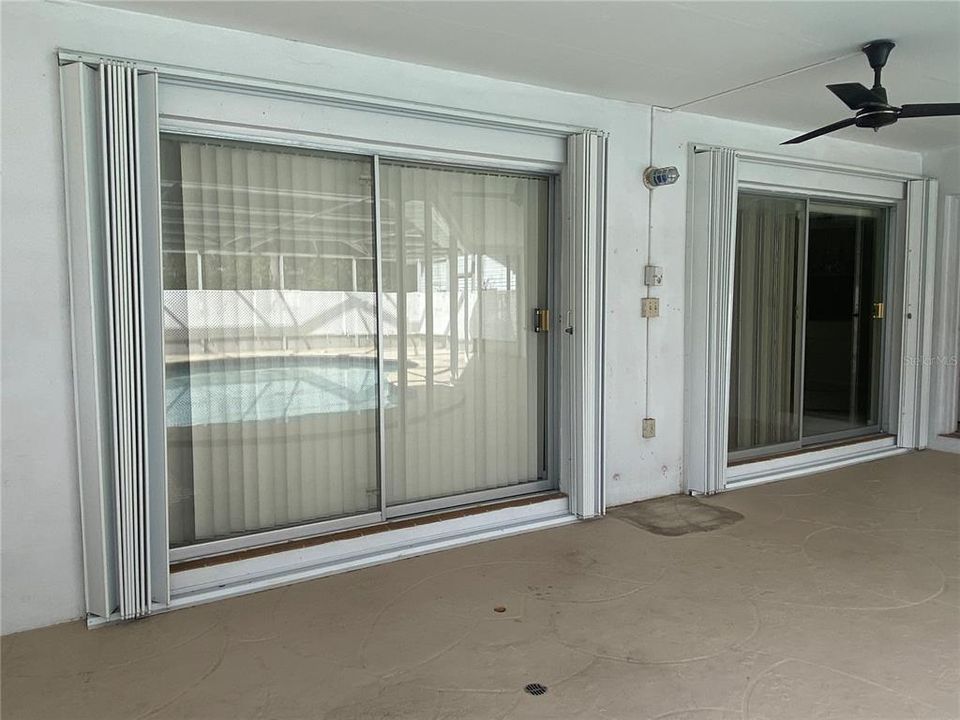 Hurricane shutters for sliding glass doors