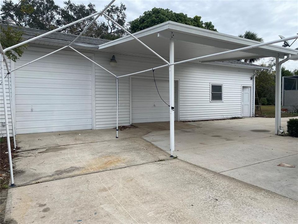 View of the carport and the detached 2 car