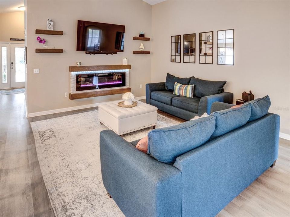 Family room with view of the electric fireplace.