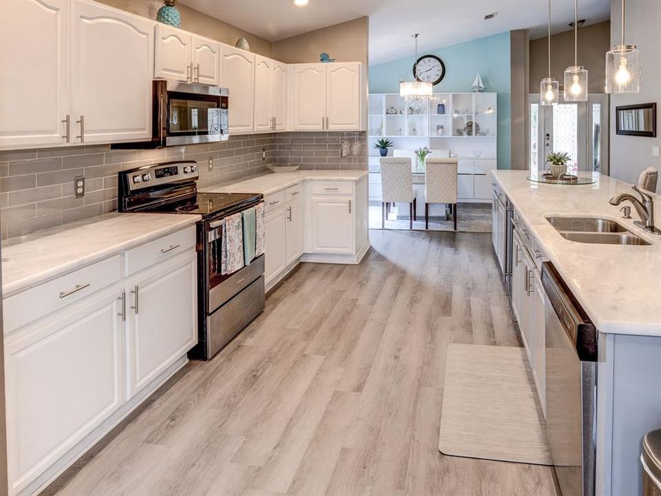 Kitchen area with view of the dining room.