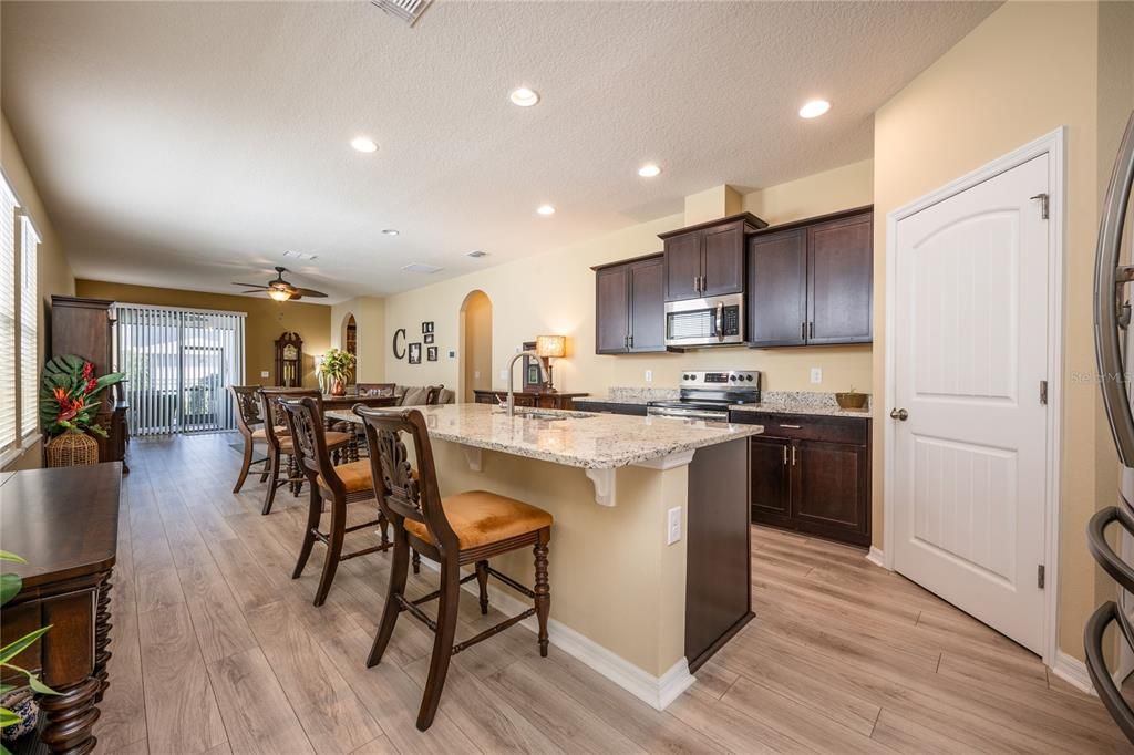 The home chef will appreciate the granite countertops, STAINLESS STEEL APPLIANCES and large ISLAND with bar seating.