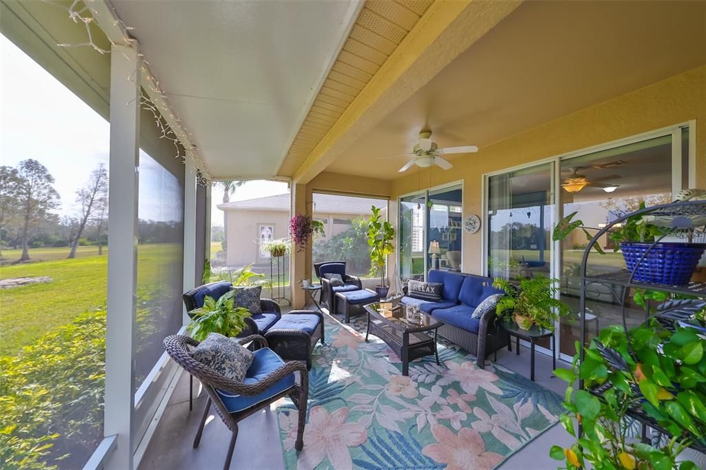 This Screened-in, extended Lanai offers lots of sunshine and privacy.-The perfect retreat after a day at the pool or golf course.