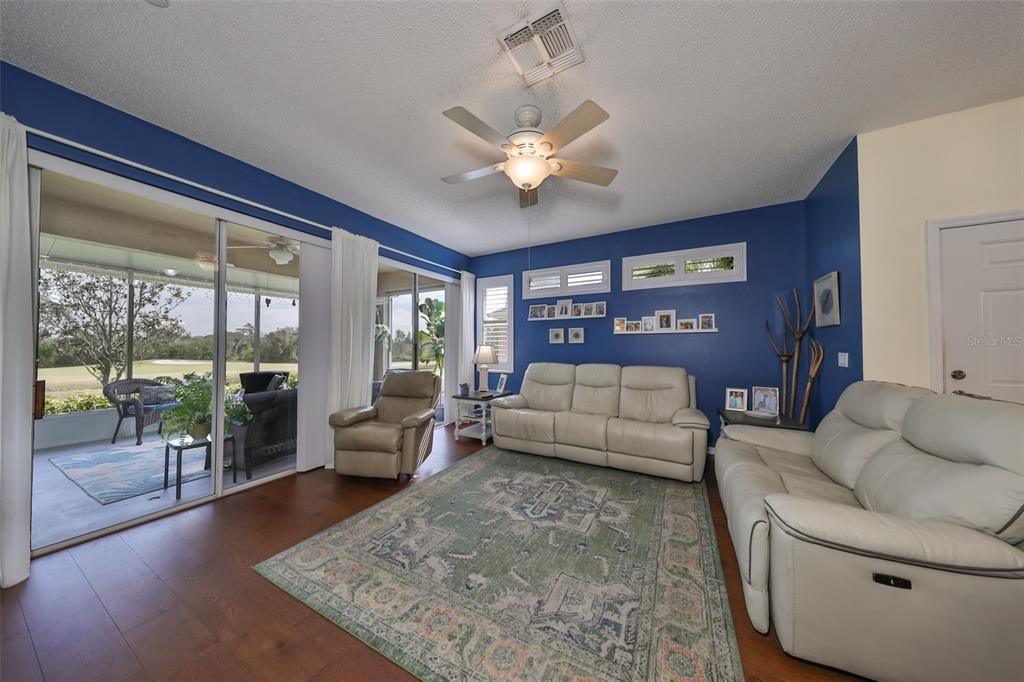 This room has double sliding glass doors that open up onto an extended covered lanai and provides an additional cozy living space.  The view is incredible!