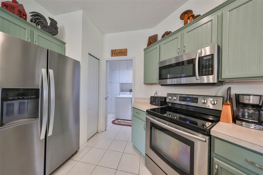 Energy efficient Stainless steel appliances and upgraded kitchen cabinetry.