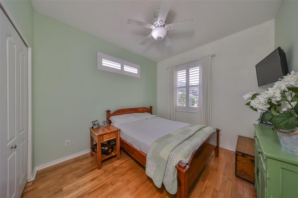 Bedroom 2 has plenty of space for guests or family to visit, along with plantation shutters and engineered hardwood floors.