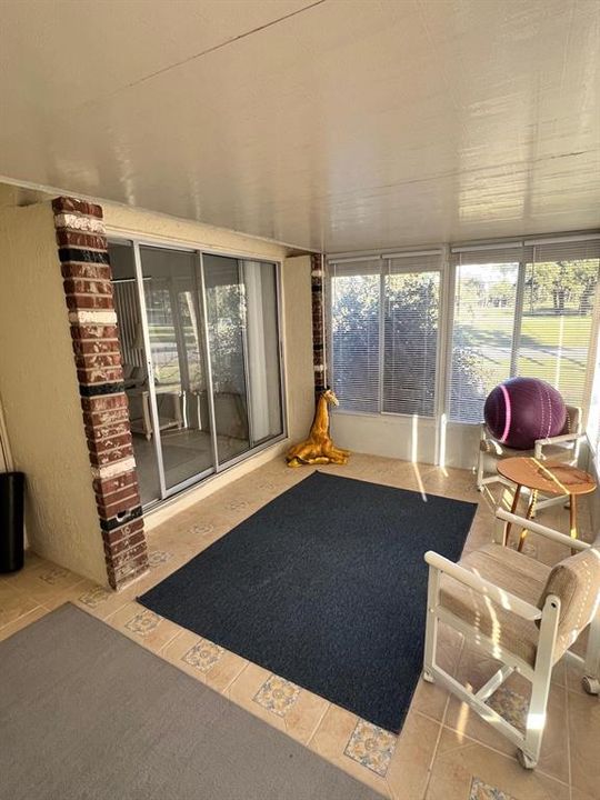 Front enclosed porch with a view to the Golf Course