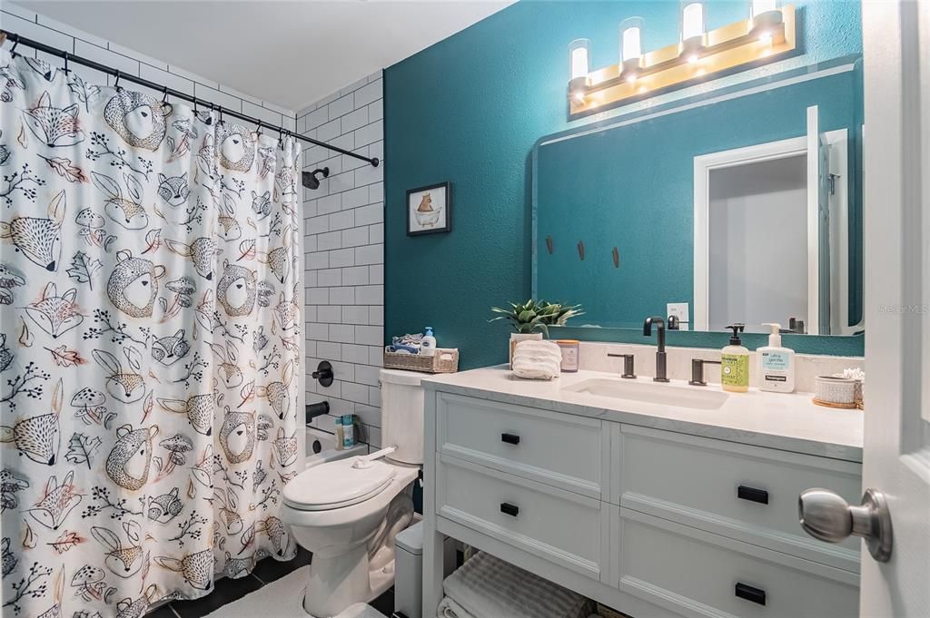 Jack 'n Jill bath shared by 2nd and 3rd bedrooms.