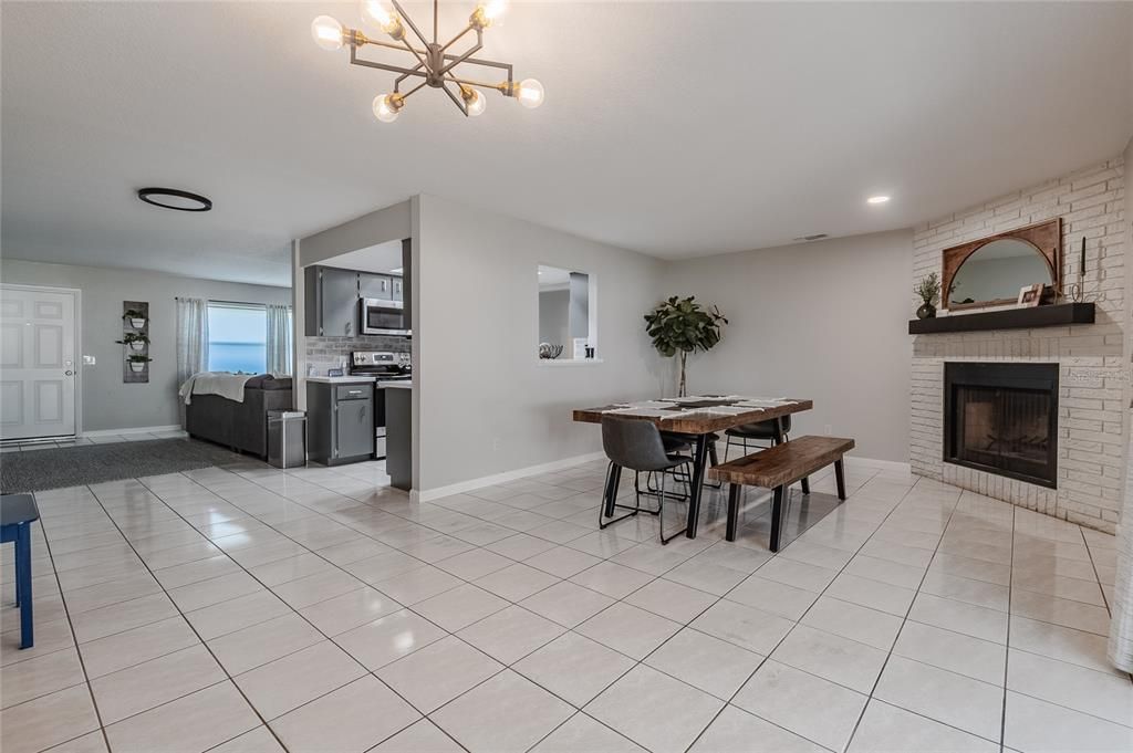 View of Dining Room with built-in wood burning fireplace.