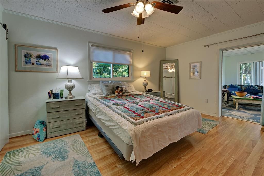 Primary Bedroom with direct access into Sunlit Florida Room.