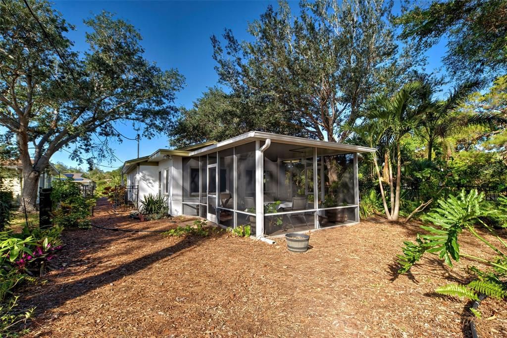 Attached screened lanai overlooking this fabulous lot.