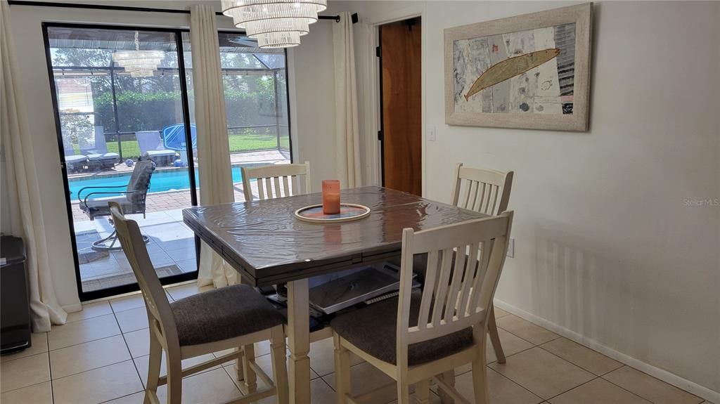 Dining area with easy pool access and view