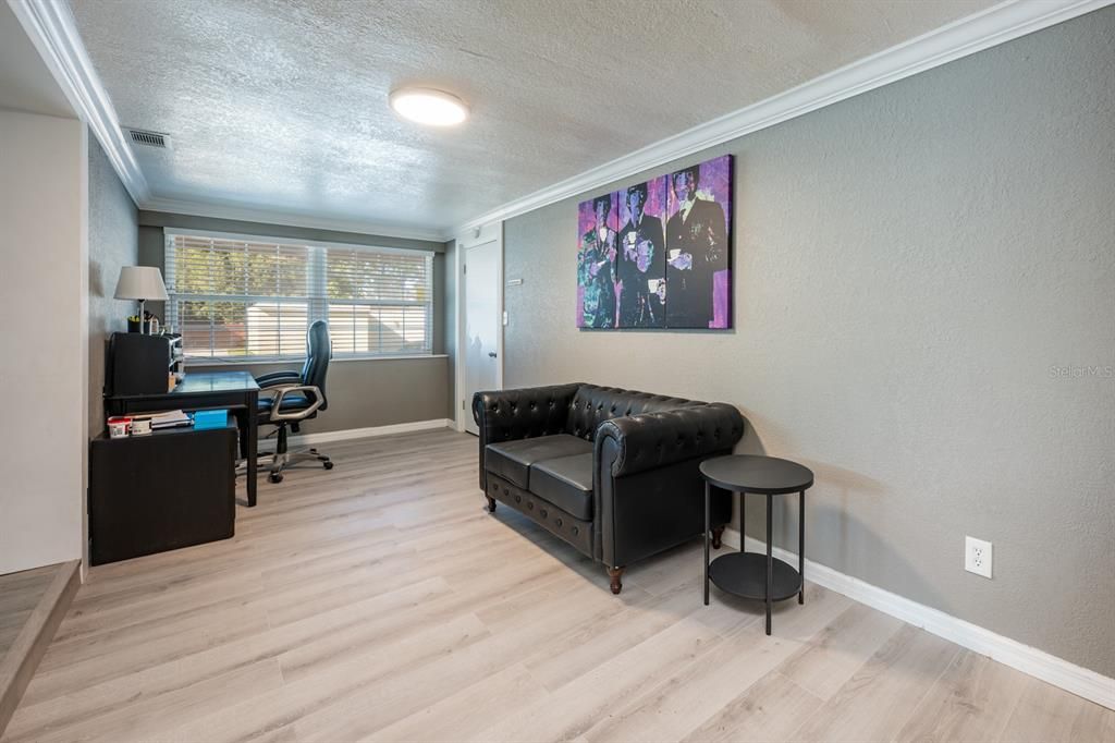 HALLWAY TO GARAGE AND PRIMARY BEDROOM