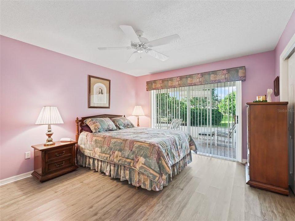 Primary Bedroom with Sliding Glass Doors out to the Lanai