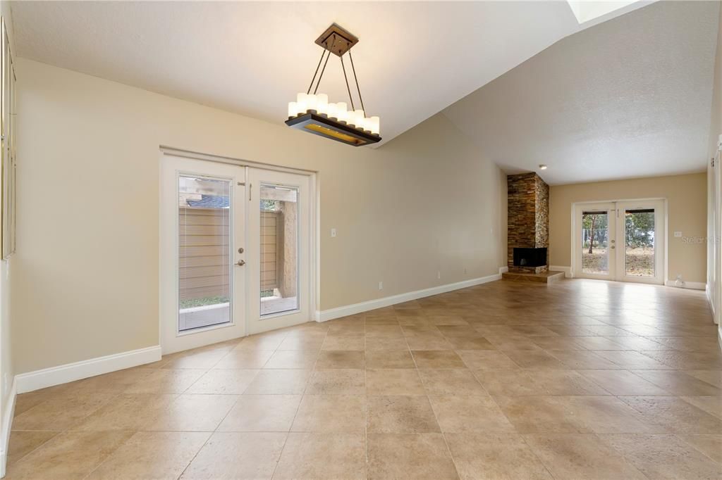 The dining room and living room both feature French doors that lead to the side patio and backyard respectively.